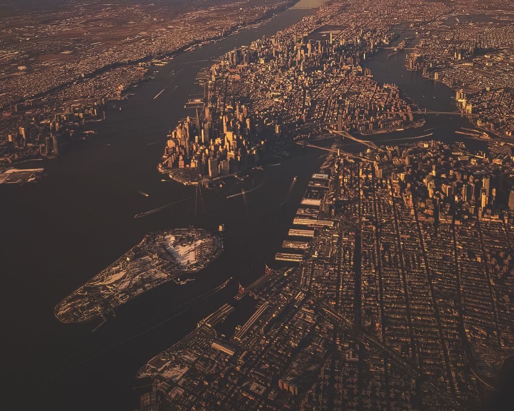 Aerial view of Manhattan skyline and surrounding boroughs at sunset New York City